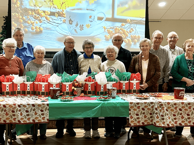 Santa's helpers at Fairhaven fill gift bags for charity.