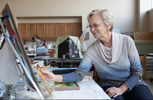 Woman painting at Acts